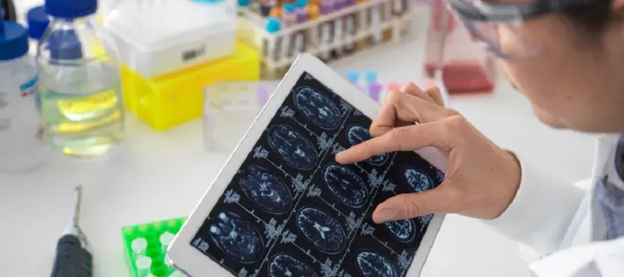 Researcher looking at brain scans