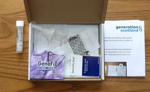 Saliva sample postal kit including sample tube and instructions.