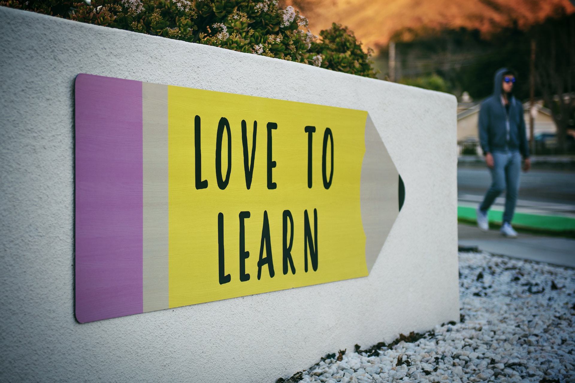 Sign saying \"Love to Learn\" outside a school